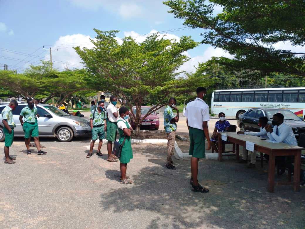 Teachers taking the details of students