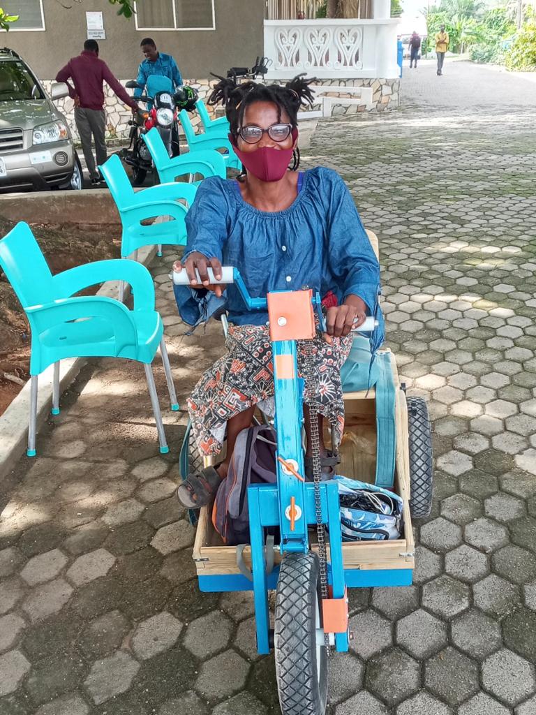 The beneficiary with her new wheelchair