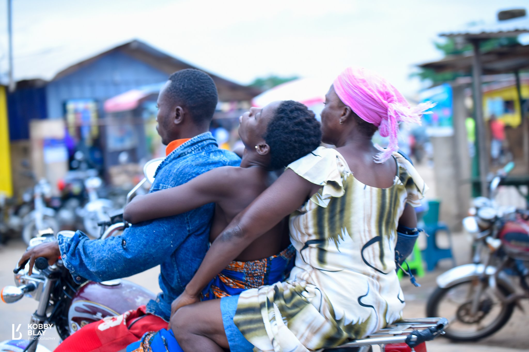 Sick woman being rushed to the hospital using okada