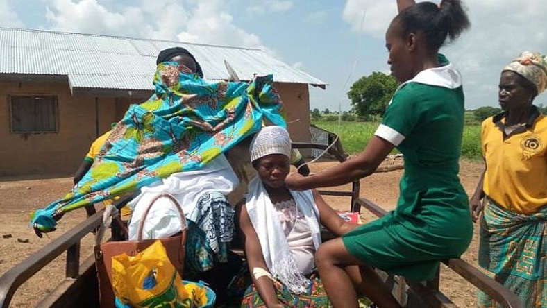 Pregnant woman receiving treatment on a tricycle