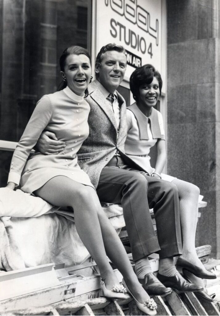 Barbara Blake Hannah (right) in a Biba dress, with Eamonn Andrews and fello...