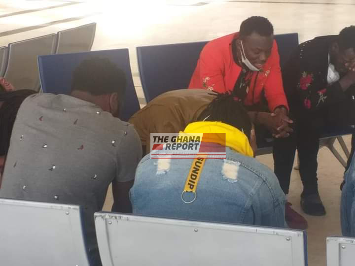 Members of the Good News Outreach Ministries in a prayer session at the Ethiopia Airport