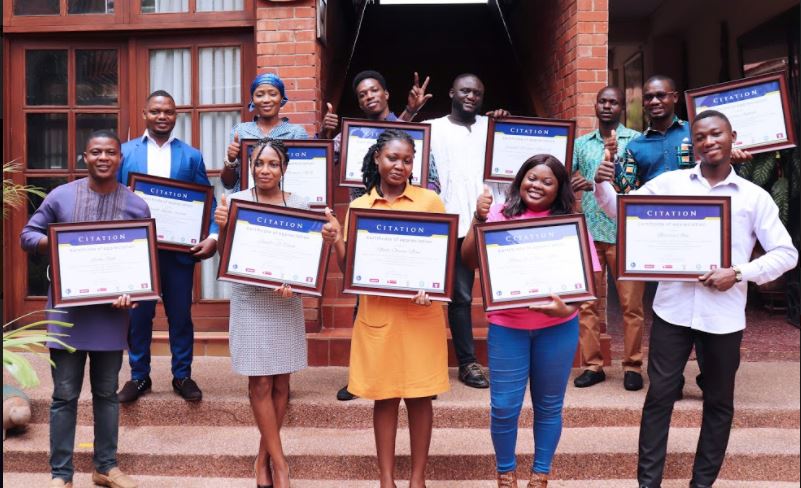 The youth advocates display their certificates after the programme