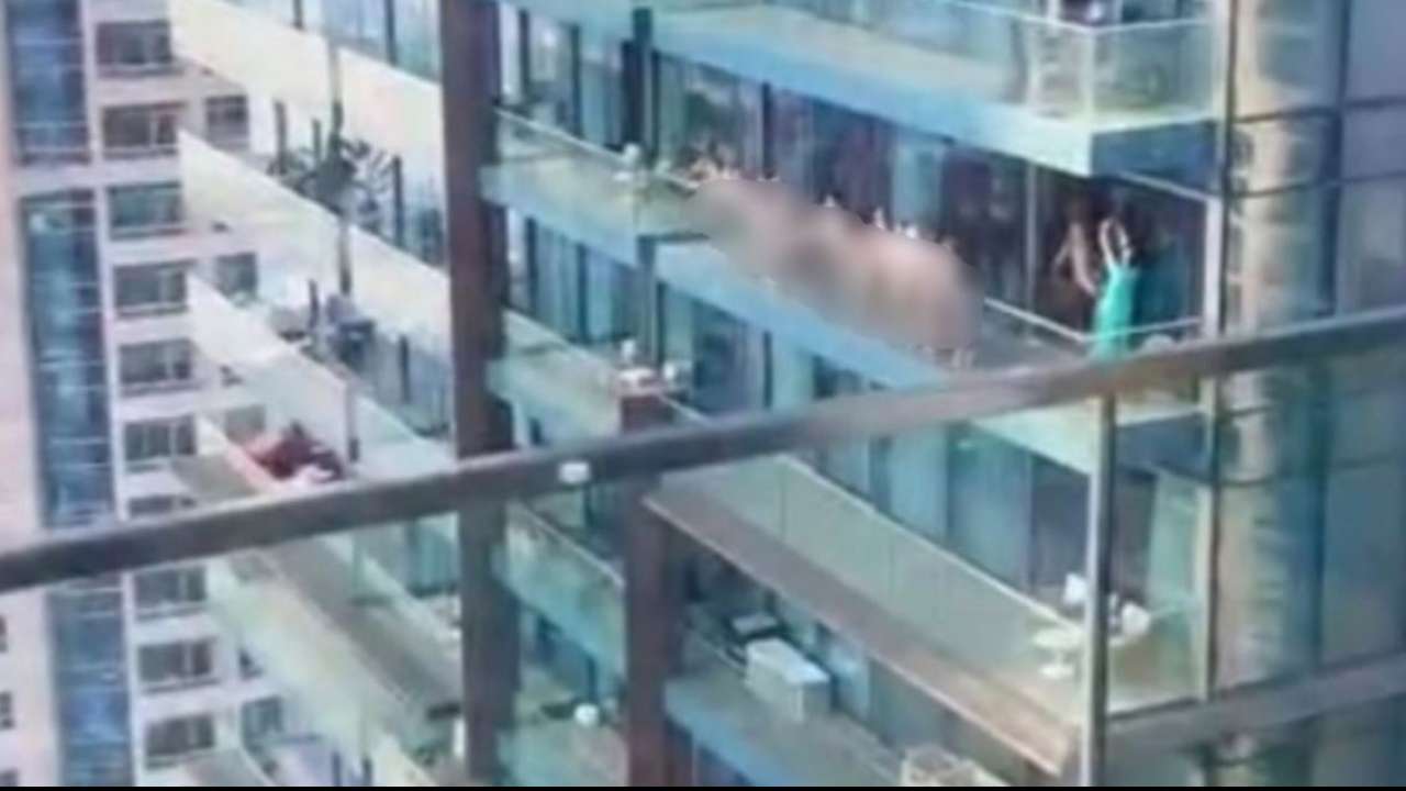 Dubai police arrest group over nude balcony shoot.