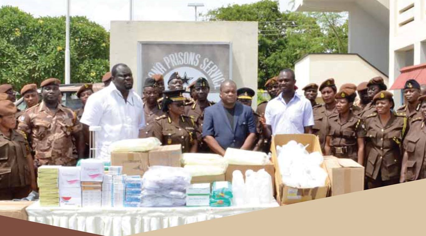 Rev. Wengam receives donations on behalf of the Prisons Service